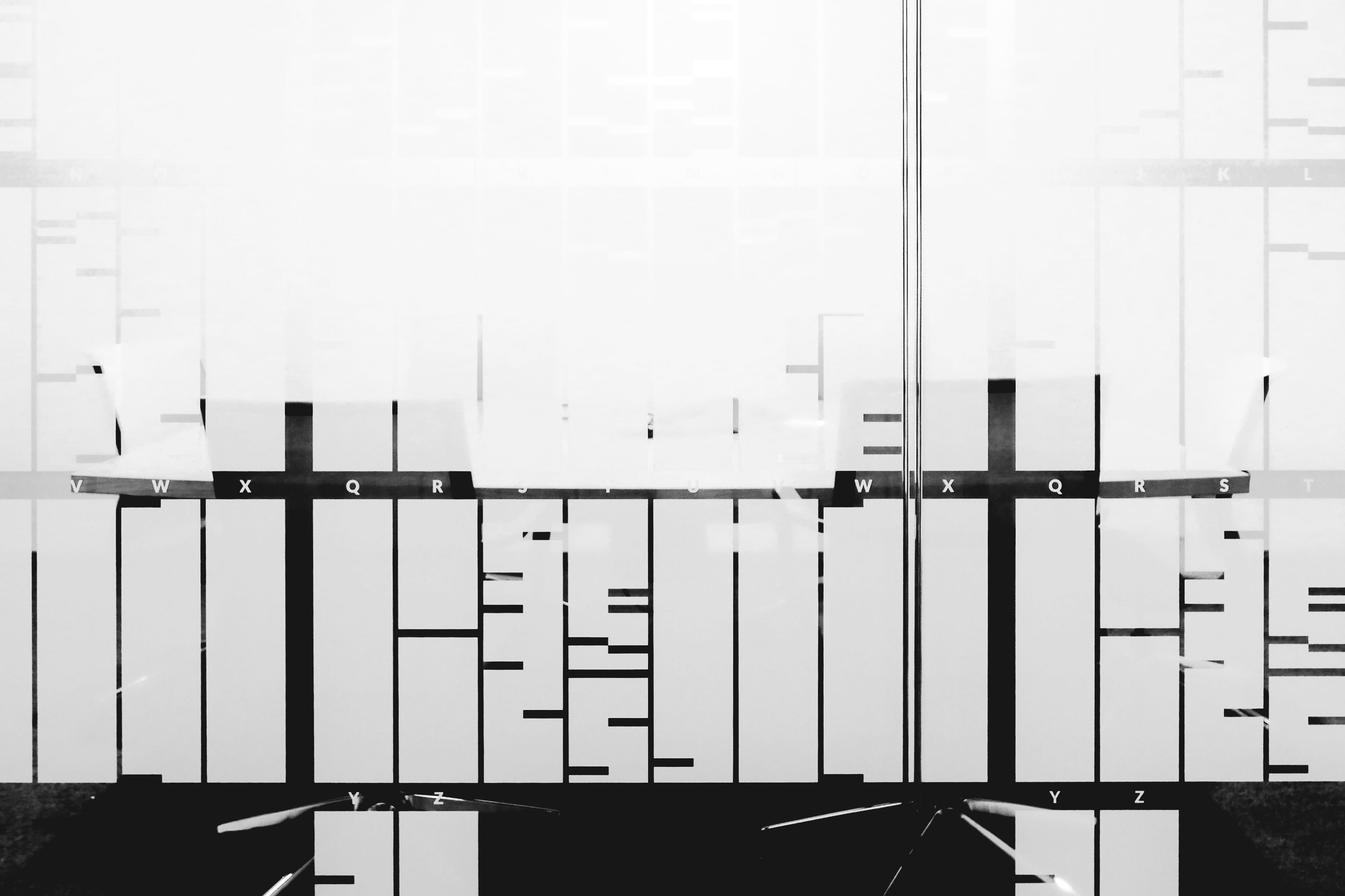 A gridded encoding system to render a Turing quotation, semitransparent, on glass.